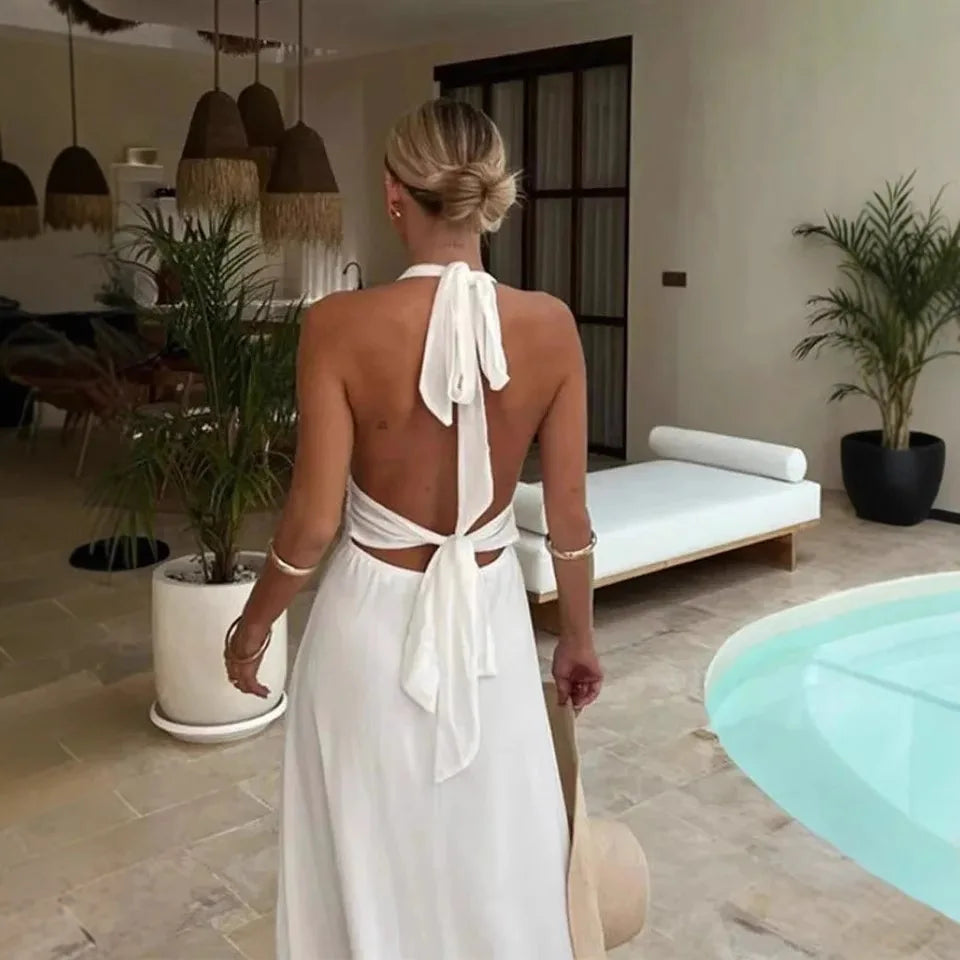 Robe longue blanche sexy dos nu à lacets et décolleté plongeant, taille haute fendue, idéale pour les vacances et les soirées en club.