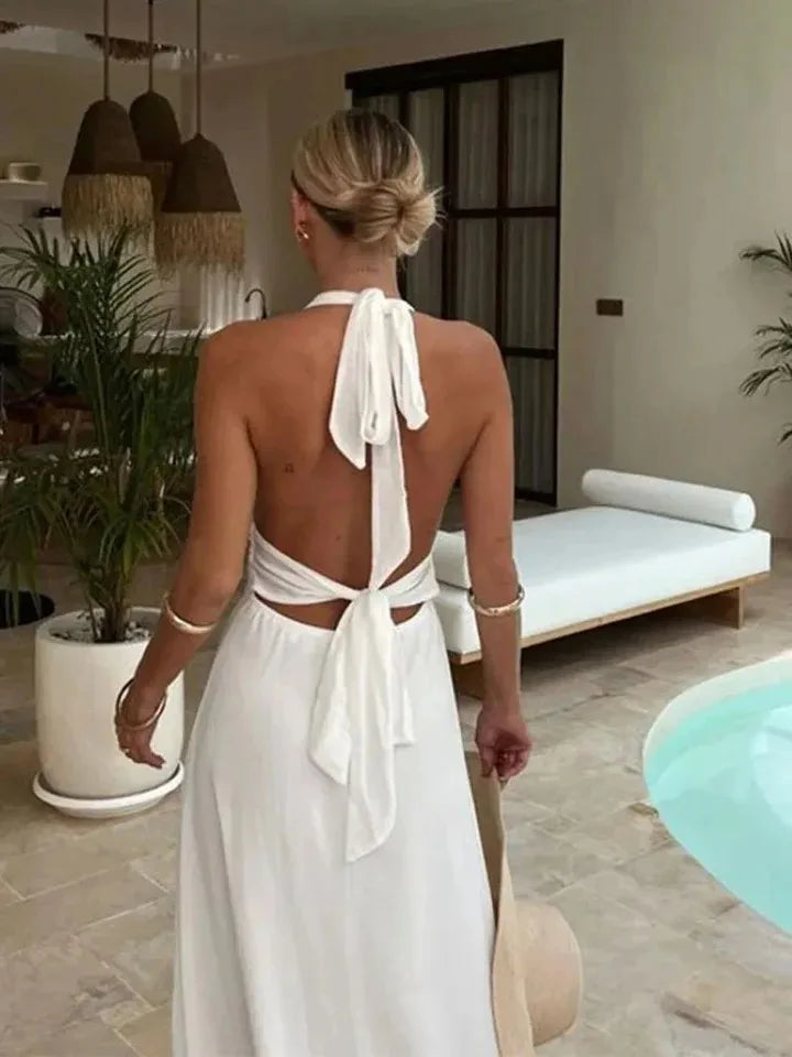 Robe longue blanche sexy dos nu à lacets et décolleté plongeant, taille haute fendue, idéale pour les vacances et les soirées en club.